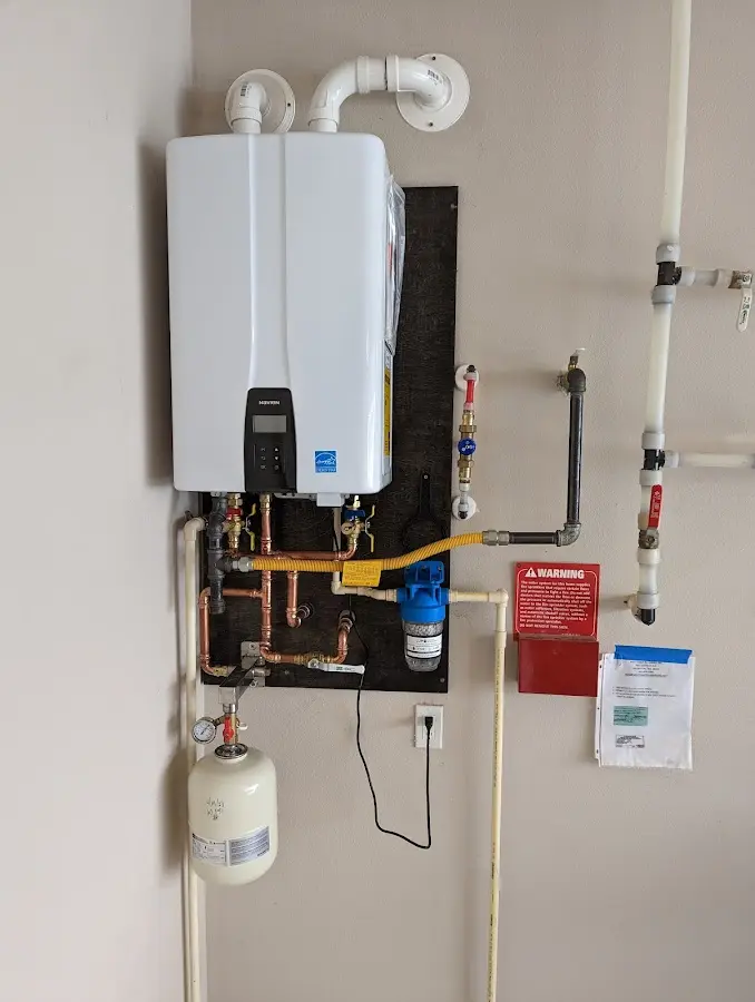 Professional plumber installing copper piping in a Fort Hood home